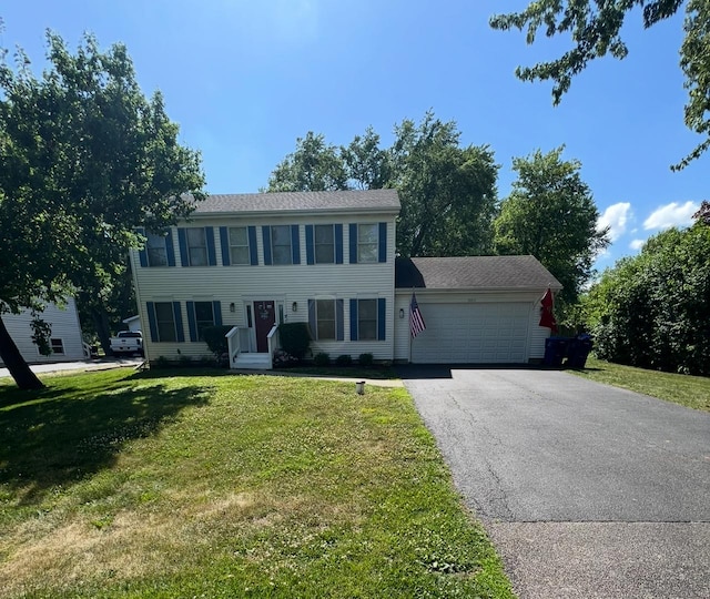 36872 N Lawrence Dr, Lake Villa, IL 60046 - colonial-style house featuring an attached garage, asphalt driveway, and a front yard