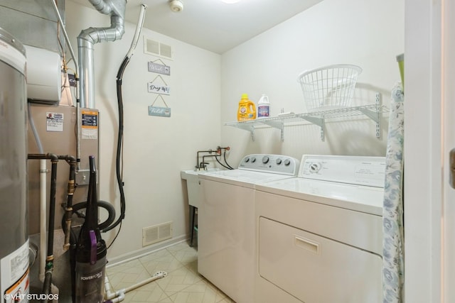 6433 Pine Cone Dr Unit 1, Tinley Park, IL 60477 - laundry room with independent washer and dryer, light tile patterned floors, and water heater