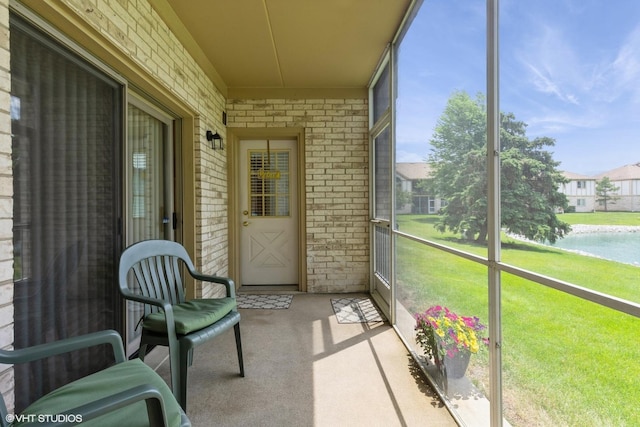 6433 Pine Cone Dr Unit 1, Tinley Park, IL 60477 - unfurnished sunroom with healthy amount of natural light and a water view