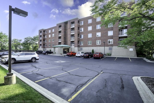 6211 Lincoln Ave Unit 402, Morton Grove, IL 60053 - view of apartment building / complex featuring uncovered parking