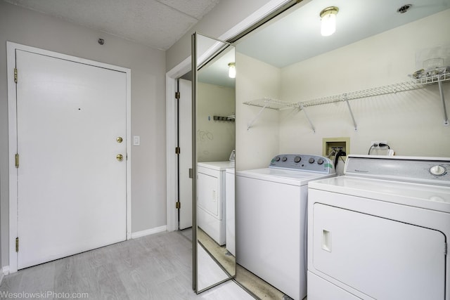 6211 Lincoln Ave Unit 402, Morton Grove, IL 60053 - washroom with independent washer and dryer and light wood-type flooring