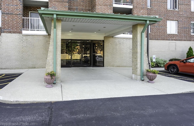 6211 Lincoln Ave Unit 402, Morton Grove, IL 60053 - view of exterior entry with brick siding