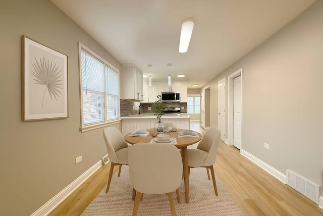 2620 W 36th Pl, Chicago, IL 60632 - dining room featuring light wood finished floors and recessed lighting