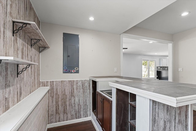 410 N 4th St, Saint Joseph, IL 61873 - kitchen featuring open shelves, electric panel, dark wood-style flooring, recessed lighting, and a wainscoted wall