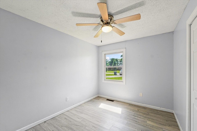 410 N 4th St, Saint Joseph, IL 61873 - unfurnished room with a textured ceiling, wood finished floors, and ceiling fan