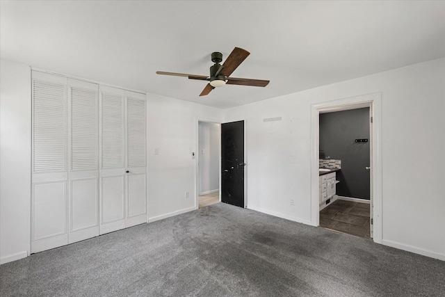410 N 4th St, Saint Joseph, IL 61873 - unfurnished bedroom featuring carpet, a closet, ensuite bathroom, and a ceiling fan