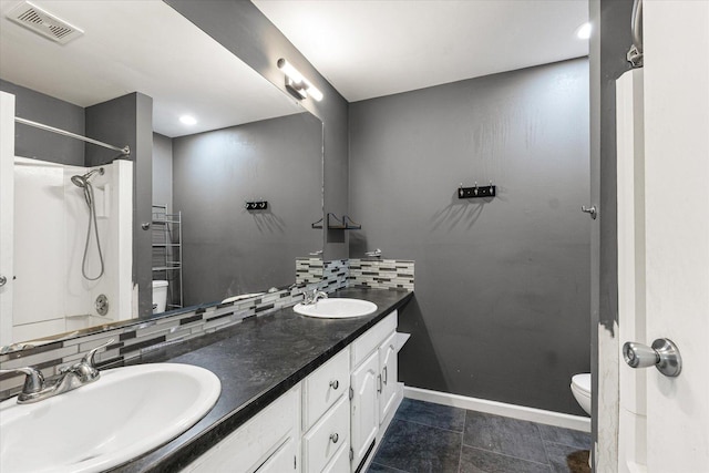 410 N 4th St, Saint Joseph, IL 61873 - bathroom featuring double vanity and decorative backsplash