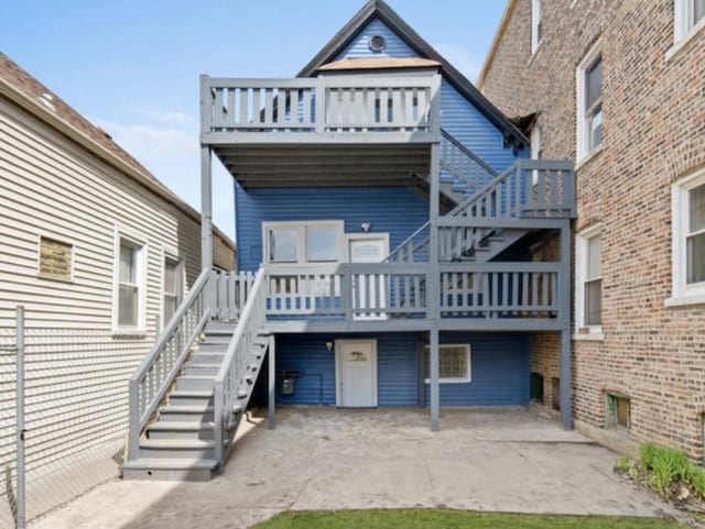 4329 S Wood St, Chicago, IL 60609 - back of property featuring stairs, a patio, and a wooden deck