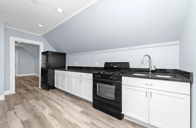 4329 S Wood St, Chicago, IL 60609 - kitchen featuring black appliances, lofted ceiling, white cabinetry, light wood-style floors, and recessed lighting