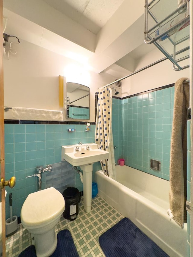 1912 W Hood Ave Unit 1B, Chicago, IL 60660 - full bathroom with tile walls, shower / tub combo with curtain, tile patterned flooring, and a wainscoted wall