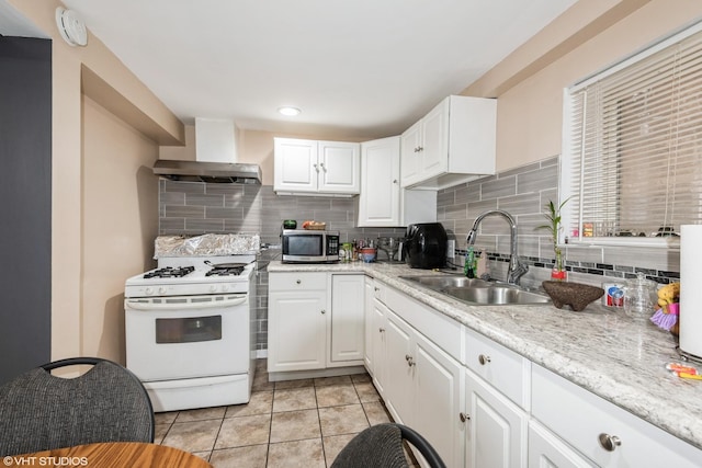 4330 S Talman Ave, Chicago, IL 60632 - kitchen featuring gas range gas stove, stainless steel microwave, tasteful backsplash, light tile patterned flooring, and recessed lighting