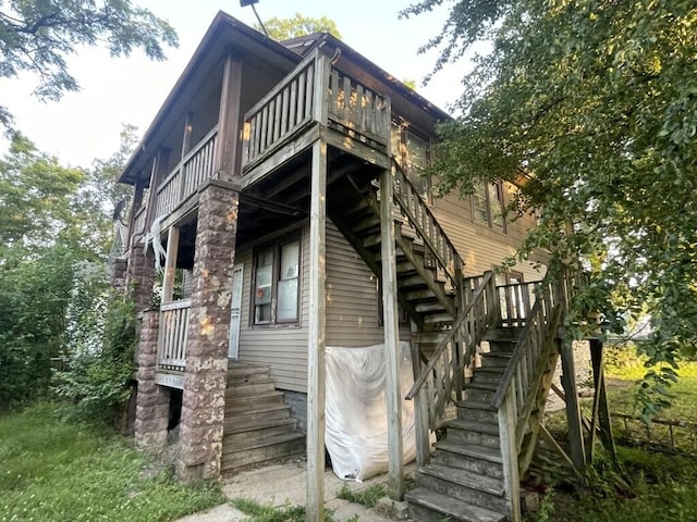 630 Belle Ct, Phoenix, IL 60426 - view of property exterior featuring stairway and a balcony