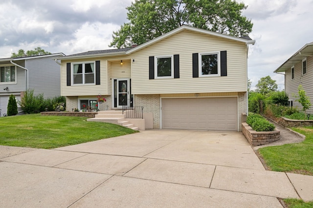 492 Winthrop Ave, Glendale Heights, IL 60139 - bi-level home featuring an attached garage, brick siding, concrete driveway, and a front yard