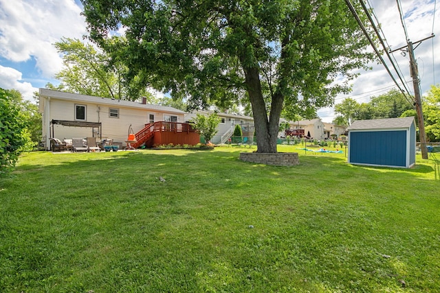 492 Winthrop Ave, Glendale Heights, IL 60139 - view of green lawn with a storage unit and a wooden deck