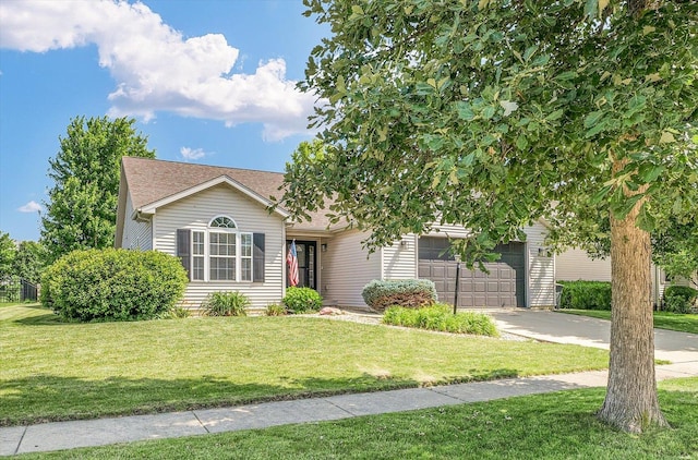 4006 Tallgrass Dr, Champaign, IL 61822 - obstructed view of property featuring concrete driveway, an attached garage, a front yard, and a shingled roof