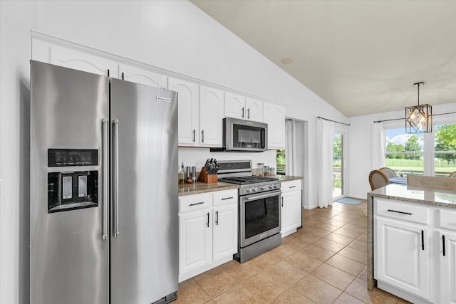 4006 Tallgrass Dr, Champaign, IL 61822 - kitchen with appliances with stainless steel finishes, lofted ceiling, white cabinets, light stone counters, and light tile patterned floors