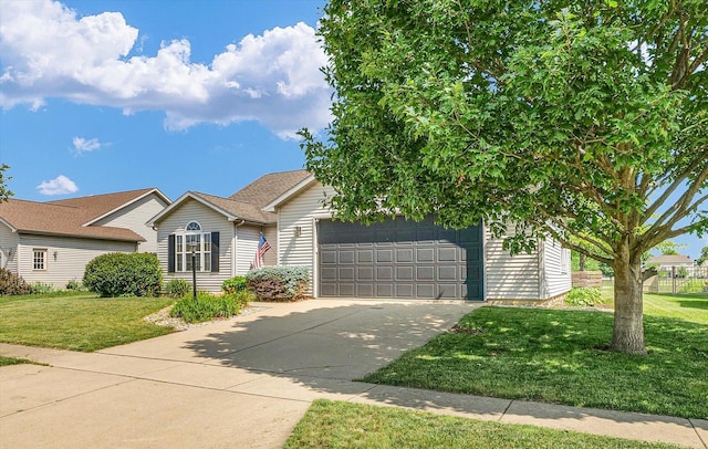4006 Tallgrass Dr, Champaign, IL 61822 - view of front of home featuring driveway, a front yard, and an attached garage