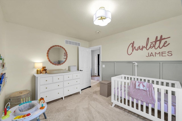 4006 Tallgrass Dr, Champaign, IL 61822 - bedroom featuring a nursery area and light carpet