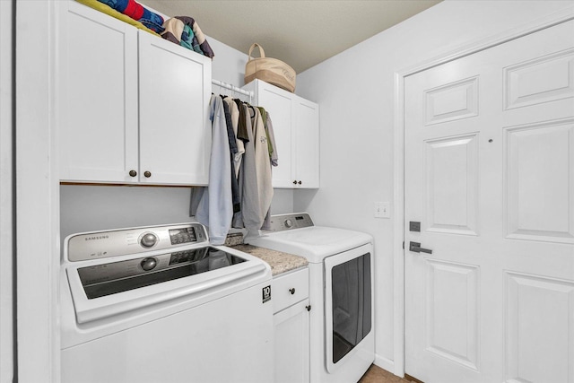 4006 Tallgrass Dr, Champaign, IL 61822 - laundry area with washing machine and clothes dryer and cabinet space