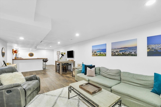 4006 Tallgrass Dr, Champaign, IL 61822 - living room featuring wood finished floors, recessed lighting, and bar