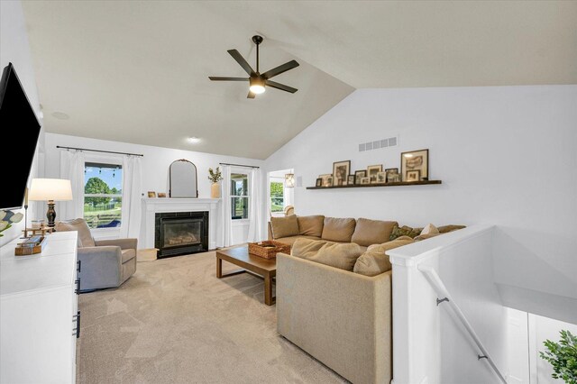4006 Tallgrass Dr, Champaign, IL 61822 - living room with ceiling fan, lofted ceiling, light colored carpet, healthy amount of natural light, and a fireplace with flush hearth
