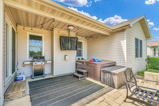 4006 Tallgrass Dr, Champaign, IL 61822 - view of patio with a hot tub and a grill