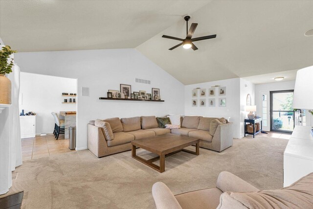 4006 Tallgrass Dr, Champaign, IL 61822 - living room featuring light carpet, ceiling fan, vaulted ceiling, and light tile patterned flooring