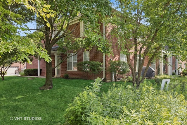 1007 Enfield Dr Unit 1007, Northbrook, IL 60062 - view of property exterior with brick siding and a lawn