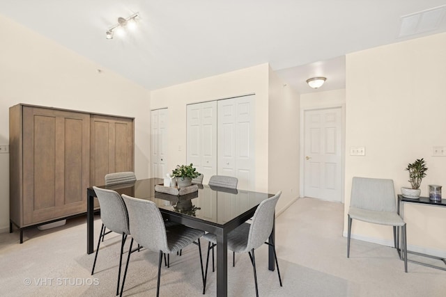 1007 Enfield Dr Unit 1007, Northbrook, IL 60062 - dining area with light carpet, lofted ceiling, and track lighting