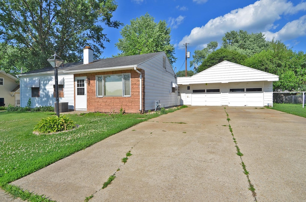1420 Seminole Dr, Ottawa, IL 61350 - single story home with a garage, a chimney, an outdoor structure, and a front lawn