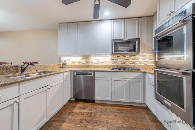 1812 S State St Unit 28, Chicago, IL 60616 - kitchen with appliances with stainless steel finishes, a ceiling fan, white cabinetry, decorative backsplash, and recessed lighting