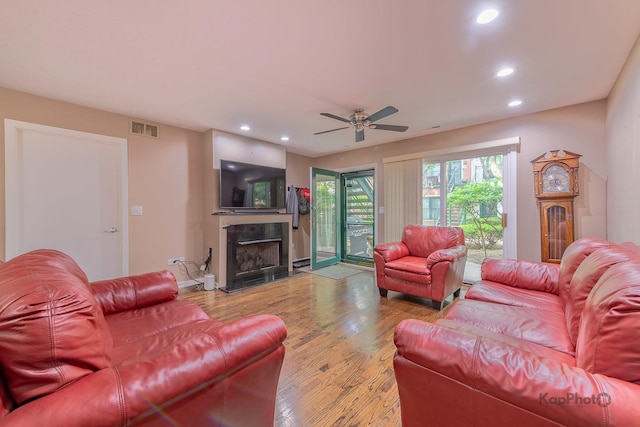 1812 S State St Unit 28, Chicago, IL 60616 - living area with a fireplace, wood finished floors, recessed lighting, and ceiling fan