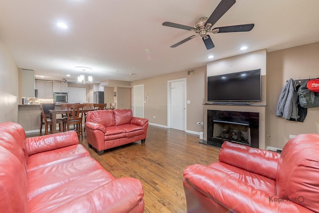 1812 S State St Unit 28, Chicago, IL 60616 - living room with ceiling fan, a fireplace, wood finished floors, and recessed lighting