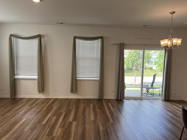 1137 Crestview Ln, Pingree Grove, IL 60140 - unfurnished room featuring dark wood-style flooring and a chandelier