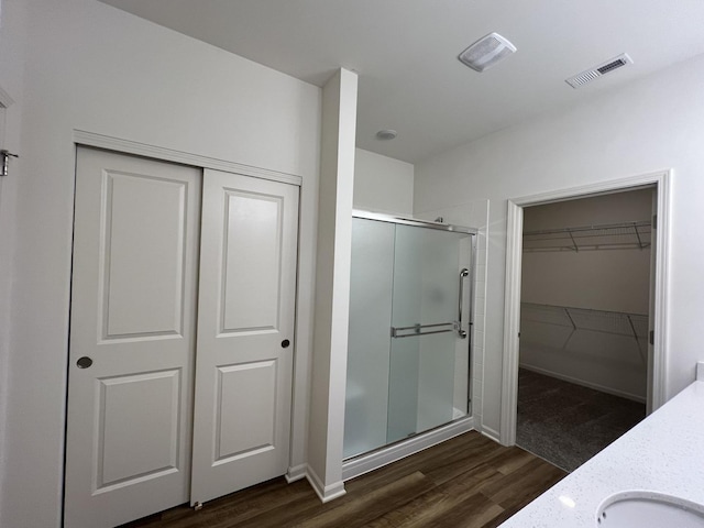 1137 Crestview Ln, Pingree Grove, IL 60140 - full bath featuring a shower stall, wood finished floors, a walk in closet, and double vanity
