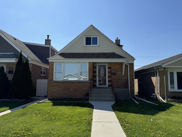 7772 Lawler Ave, Burbank, IL 60459 - bungalow-style home with brick siding, a front yard, a chimney, and a shingled roof