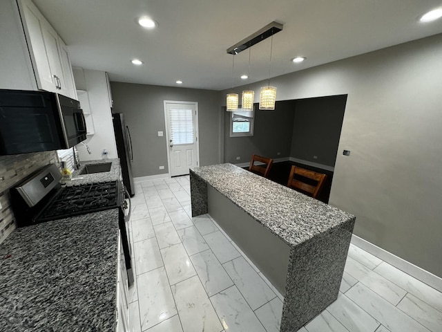 7772 Lawler Ave, Burbank, IL 60459 - kitchen with appliances with stainless steel finishes, light marble finish flooring, a center island, light stone counters, and recessed lighting