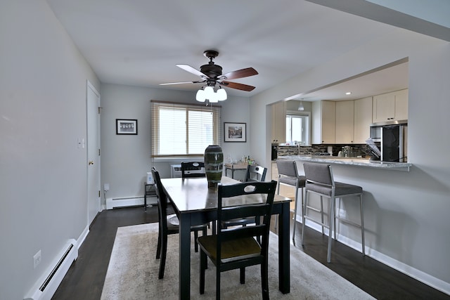6869 N Overhill Ave Unit 2B, Chicago, IL 60631 - dining area with dark wood finished floors, a baseboard radiator, ceiling fan, and recessed lighting