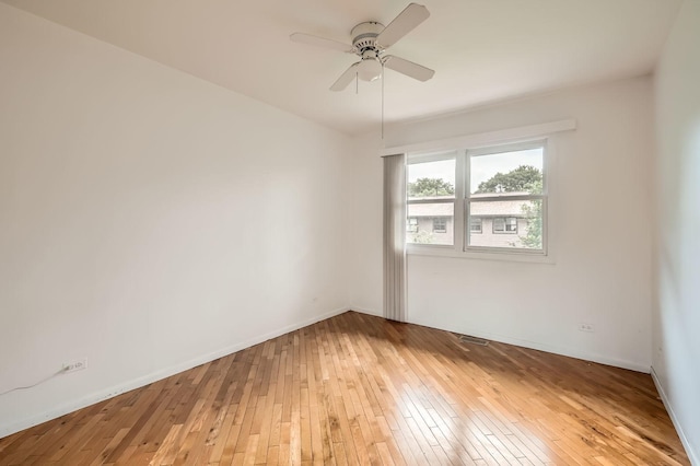 37 White Birch Ln, Westmont, IL 60559 - empty room with light wood finished floors and a ceiling fan