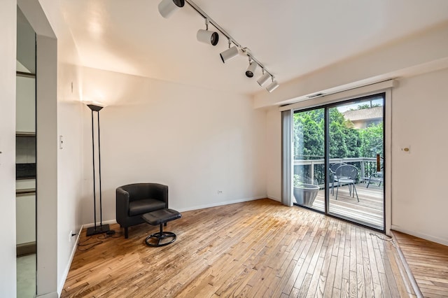 37 White Birch Ln, Westmont, IL 60559 - unfurnished room with rail lighting and light wood-style floors