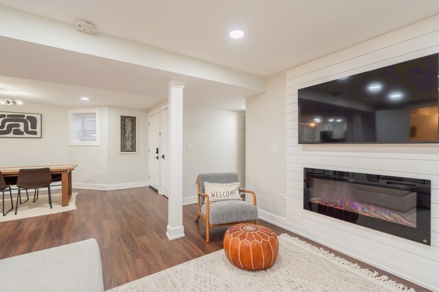 5901 N Navarre Ave, Chicago, IL 60631 - living room with dark wood-style floors, a glass covered fireplace, and recessed lighting