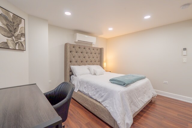 5901 N Navarre Ave, Chicago, IL 60631 - bedroom with a wall unit AC, wood finished floors, and recessed lighting