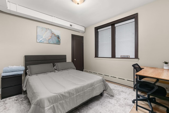 5901 N Navarre Ave, Chicago, IL 60631 - bedroom with a baseboard radiator, a desk, and wood finished floors