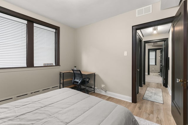 5901 N Navarre Ave, Chicago, IL 60631 - bedroom featuring light wood-type flooring and baseboard heating