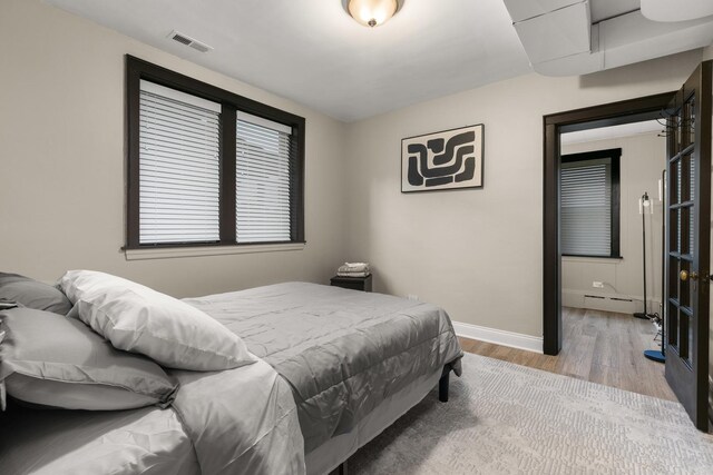 5901 N Navarre Ave, Chicago, IL 60631 - bedroom with wood finished floors and a baseboard radiator