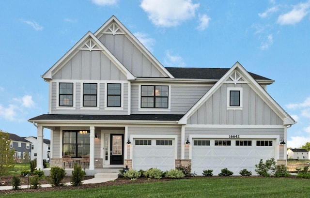 16642 S Sun Meadow Dr, Lockport, IL 60441 - craftsman inspired home featuring board and batten siding, covered porch, an attached garage, a front lawn, and stone siding
