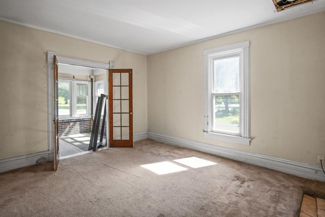 428 E Wilson St, Batavia, IL 60510 - carpeted empty room with ornamental molding and french doors
