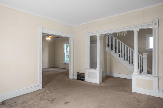 428 E Wilson St, Batavia, IL 60510 - carpeted empty room featuring crown molding, a ceiling fan, and stairway