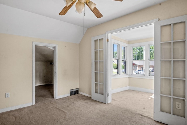 428 E Wilson St, Batavia, IL 60510 - empty room with a ceiling fan, carpet floors, french doors, and lofted ceiling