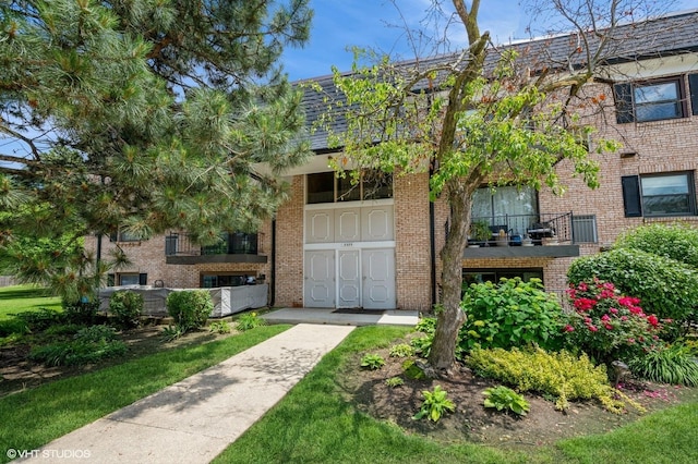 3325 Kirchoff Rd Unit 3E, Rolling Meadows, IL 60008 - view of front of home with brick siding and a balcony